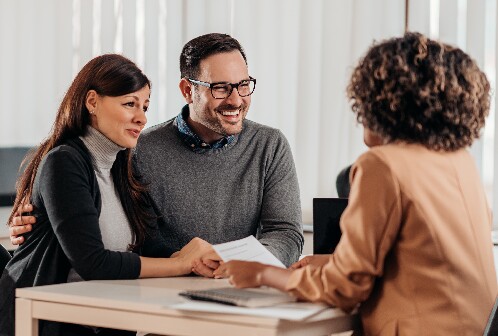 A Couple Speaking to Bank Manager